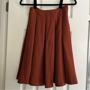 uniqlo burnt orange pleated a-line skirt